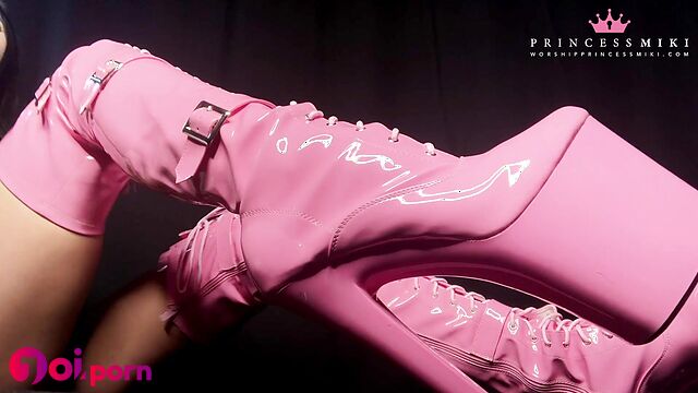 Brunette stroking her pink sexy latex boots - Princess Miki
